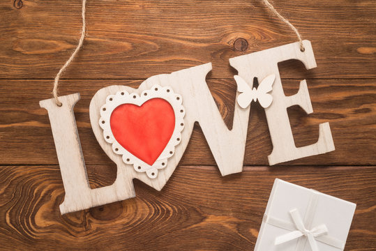  Love sign on wooden background 
