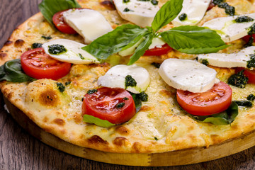 Pizza Caprese with basil
