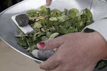 Miner with a bowl of coca leaves in Potosi, Bolivia