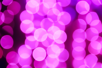 Texture from the blurred purple circles in bokeh style for design. Defocused lights of the city.