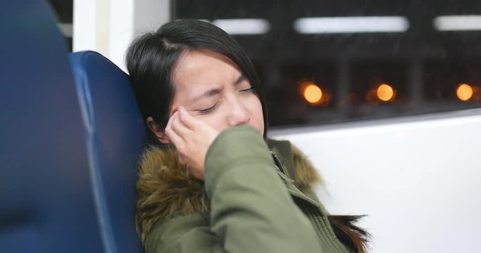 Woman feeling sea sick on ferry