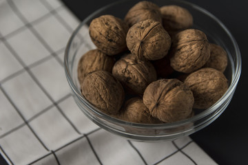 A bowl of whole walnuts. Organic food, healthy food concept