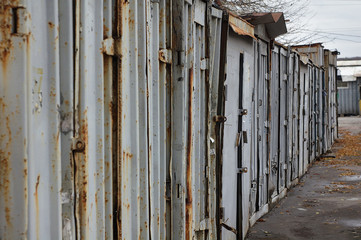 Close up view, of a row of shipping containers, at a self storage unit