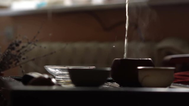 Pouring of Green Tea from Gaiwan at Traditional Chinese Tea Ceremony