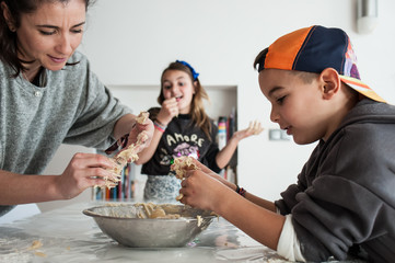 family making cookies at home