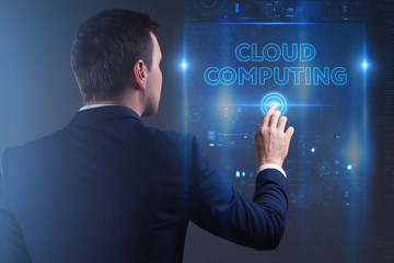 Business, Technology, Internet and network concept. Young businessman working on a virtual screen of the future and sees the inscription: Cloud computing