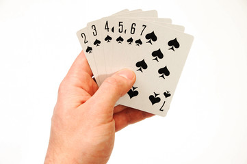 playing cards in hand on a white background