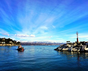 Fototapeta na wymiar Entrance to the port Moscenicka Draga on the Adriatic sea in Croatia with town Rijeka in the background