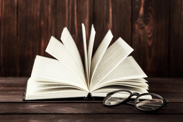 Old books on wooden background. The source of information. Books indoor. Home library. Knowledge is power