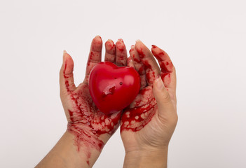 blood-stained heart and hand white background
