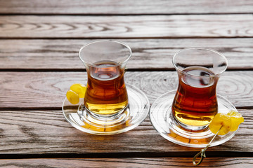 Two cups of traditional Turkish tea on a table in a street cafe in Istanbul, Turkey.