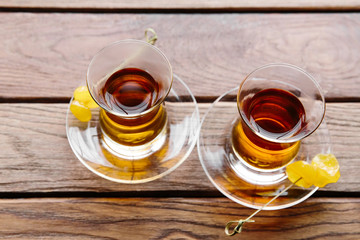 Two cups of traditional Turkish tea on a table in a street cafe in Istanbul, Turkey.