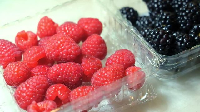 Raspberry and blackberries in a cocktail container in a bar