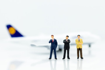 Miniature business people : businesses team with plane. Image use for background travel, business trip travel advisory agency of transportation concept.