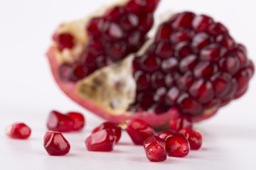 fresh pomegranate isolated onblack background close-up