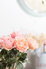 Bouquet flowers of pink roses in glass vase. Shabby chic home decor. florist at a flower shop.