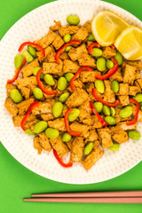 Deep Fried Chinese Style Vegetarian or Vegan Tofu With Spicy Red Chillies And Edamame Beans