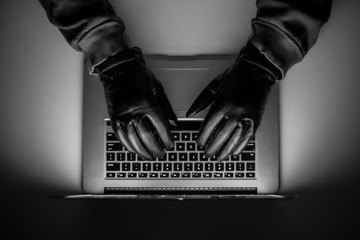 Cybercrime, a laptop hacker, writes codes to access unauthorized things, an illegal way, hacker,...