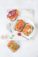 Smorrebrod with red fish on rye bread