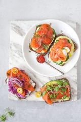 Smorrebrod with red fish on rye bread