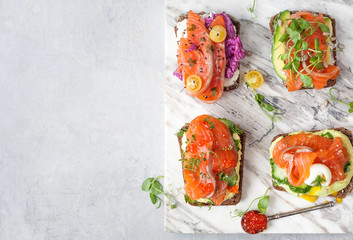 Smorrebrod with red fish on rye bread