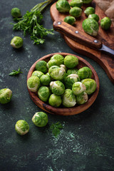 Brussels sprouts on green concrete background