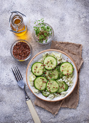 Healthy spring salad with cucumber, flax seed and cress 