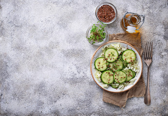 Healthy spring salad with cucumber, flax seed and cress 