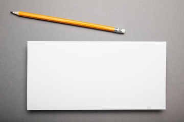 White flyer template paper on gray background.
