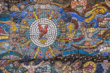 Multicolored mosaic on the walls of buildings in one of the courtyards of St. Petersburg.