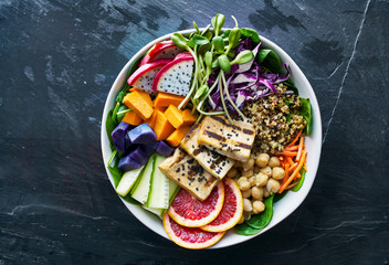 colorful buddha bowl with grilled tofu and dragon fruit © Joshua Resnick