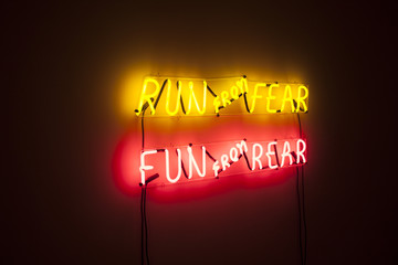 Run from Fear of light in total darkness. Neon expression.