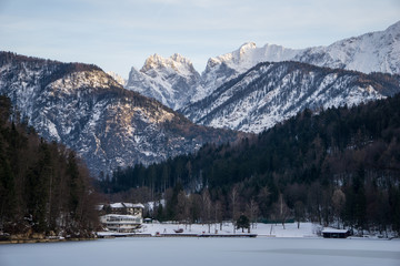 Fototapeta premium Restaurant and cabin on the shore of the Hechtsee lake in the Alps of Tyrol