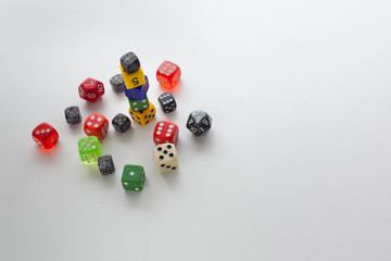 Randomly scattered and stacked dice framed to the left