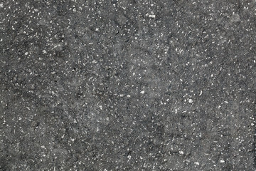 Rolled asphalt grainy texture wallpaper. Rolled bitumen surface desktop picture. Rolled bitumen...