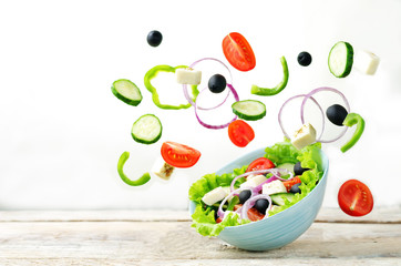 Greek Salad with flying ingredients