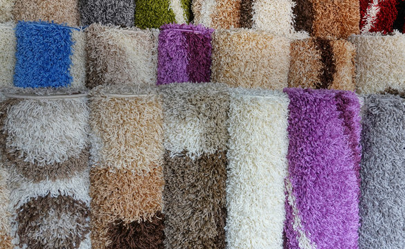 Carpets variety selection rolled up rugs shop store