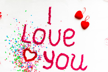 Inscription in knitted letters on a white background. St. Valentine's Day isolate