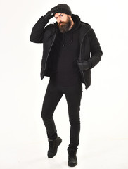 Obraz premium Macho with beard and mustache wears winter jacket