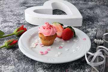 Delicious cupcake for Valentine Day. cake for Valentines day with chocolate and strawberries. Traditional homemade with red roses