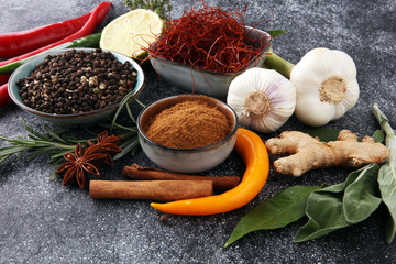 Spices and herbs on grey background. Food and cuisine ingredients.