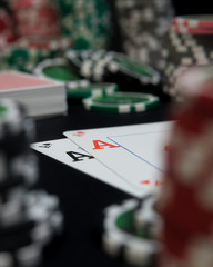 poker chips and cards with aces
