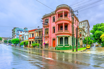 Ancient buildings in the street of Cuban Havana at noon after rain