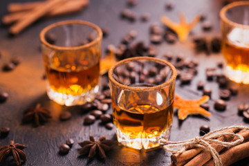 Whiskey, brandy or liquor, spices, anise stars, coffee beans, cinnamon sticks