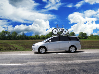 Fototapeta na wymiar Car with the bycycle on the highway