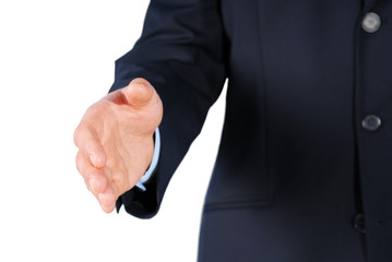 Closeup of a businessman in suit giving hand for handshake