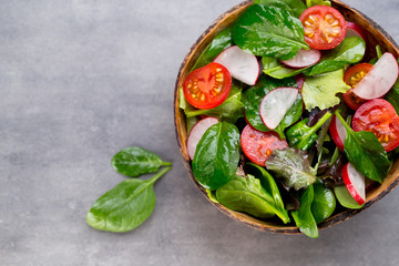 Fresh salad with baby spinach and tomato, radish und salad.