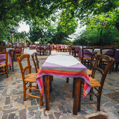 Empty greek tawern in the garden, Crete Island, Greece