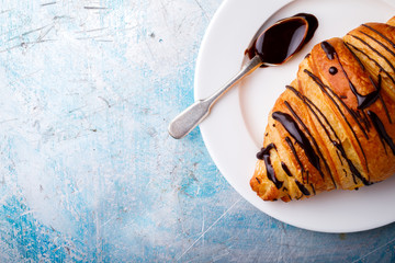   Breakfast Continental  with Fresh  Croissants with Chocolate and Toping on a blue Background  Delicious Baking Top View Copy space for Text
