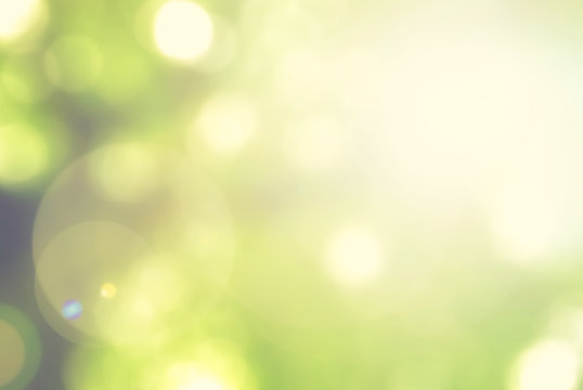 Blurred sky background with nature glowing sun light flare and bokeh